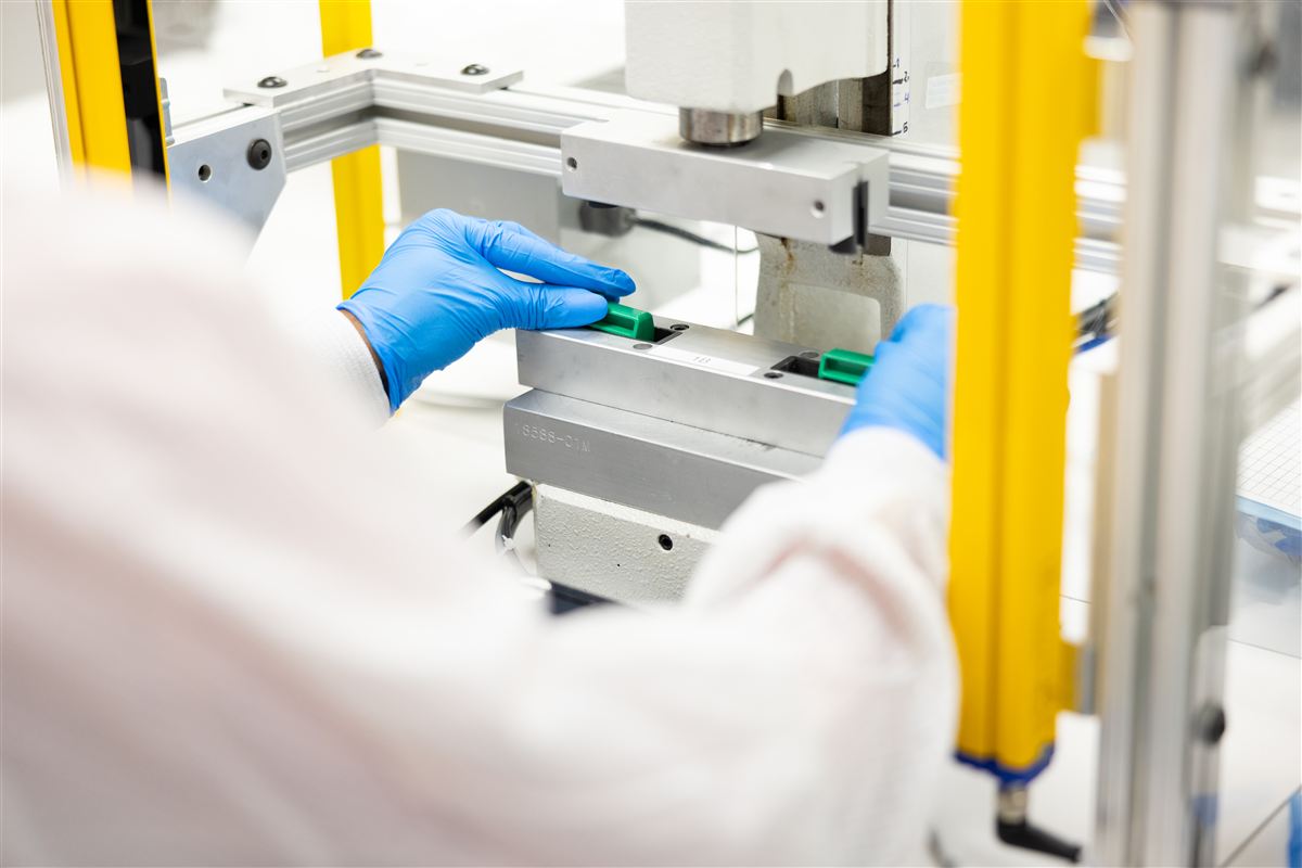 Operator loading component into insert molding fixture